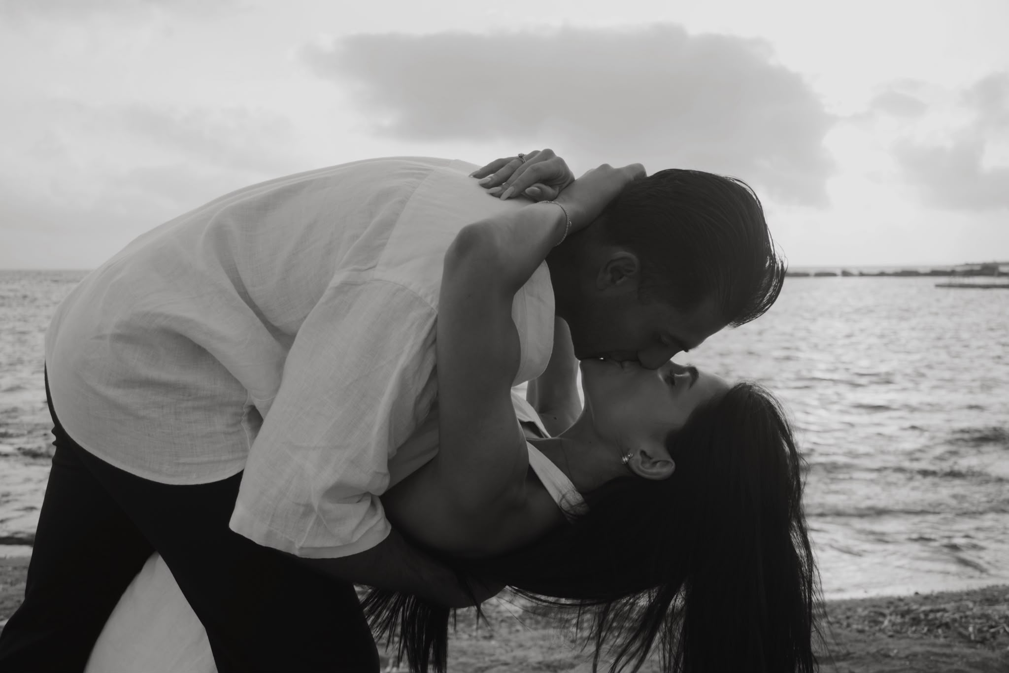 Kyriakos dips Maria into a kiss by the sea